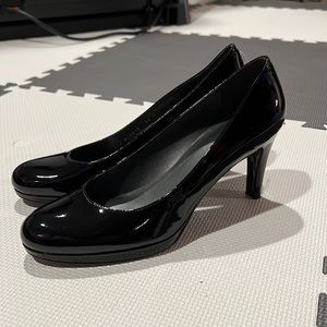 Stuart Weitzman black patent leather pumps